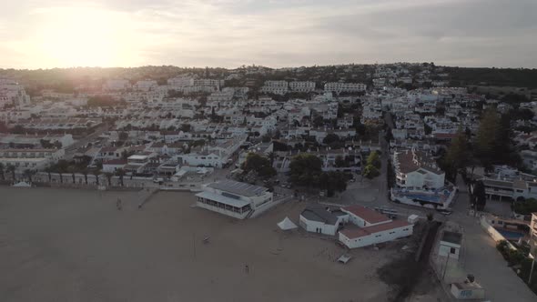 Seaside townhouses, Praia da Luz. Empty beach aerial view during sunset