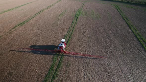 Tractor Spraying Glyphosate Herbicide onto Fields