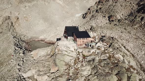 Cabine Orny in the swiss alps, rocky mountains and lake. aerial drone view