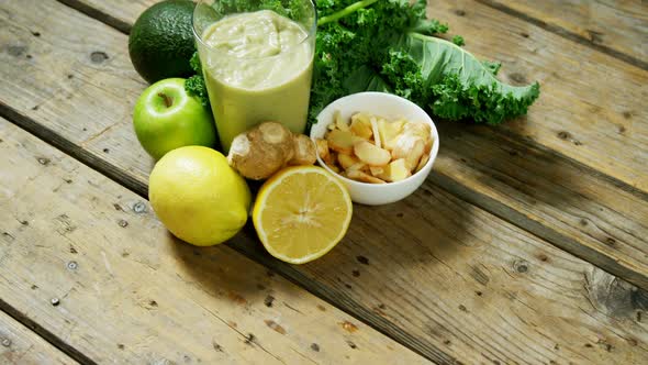 Ingredients and vegetable smoothie on wooden table 4k