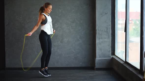 Beautiful Fitness Woman Doing Sport Exercises in the Gym