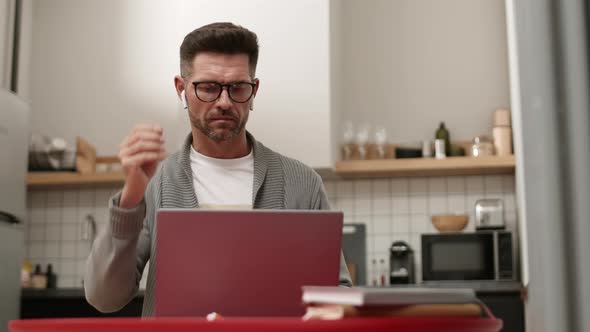 Man Starting Online Conference at Home