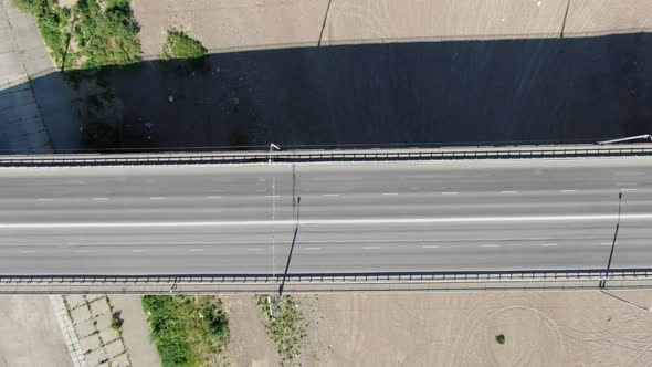 Aerial filming. Cars go over the bridge over the Tom river, Tomsk, Siberia, Russia