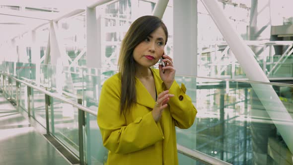 Japanese woman talking on her smartphone in Tokyo Japan