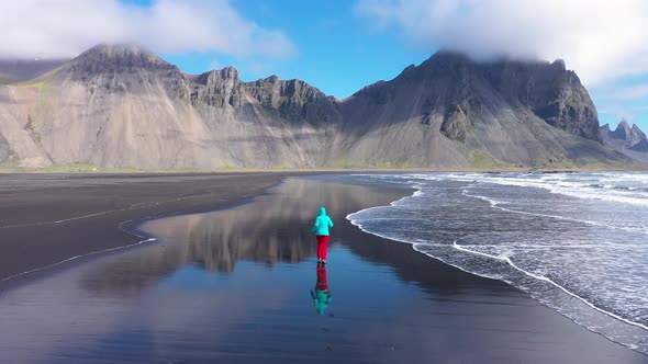 Woman Jogging on the Atlantic Ocean Coast in Iceland