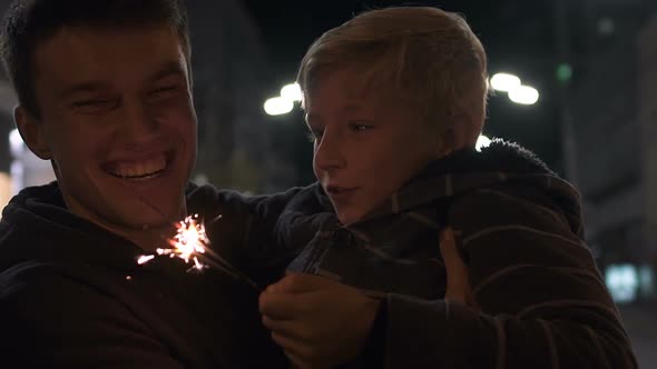 Single Father and Son Celebrating Christmas, Having Fun Together, Happiness