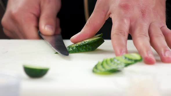Hands Cutting Cucumber