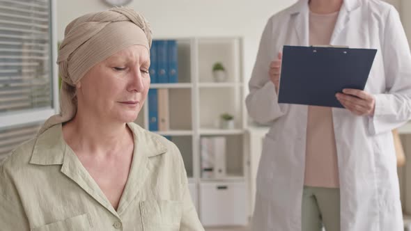 Woman with Oncology Crying at Doctor Office