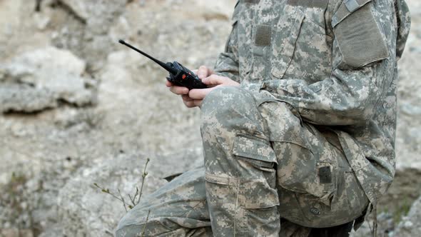 Cropped Shot of Military Man Body Soldier Standing on Knee in Army Combat Uniform Speaking in