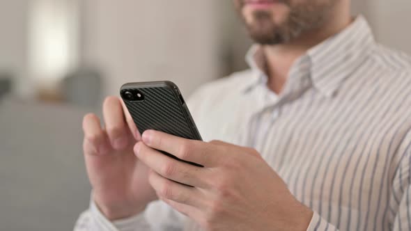 Close Up of Hands of Young Man Using Smartphone 