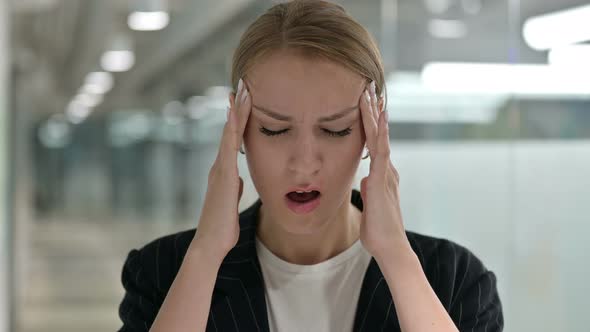 Portrait of Exhausted Businesswoman Having Headache