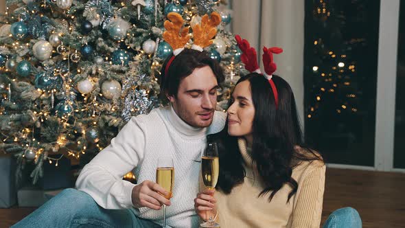 Happy couple celebrating christmas at home