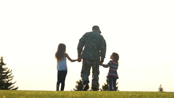 Soldier with Little Girls Walking in the Park, Back View