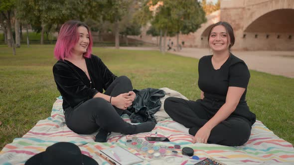 Happy Young White Girls Having a Leisure and Relaxation Time at the Public Park