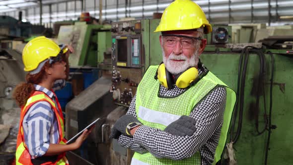 Senior Factory Worker or Engineer Close Up Portrait in Factory