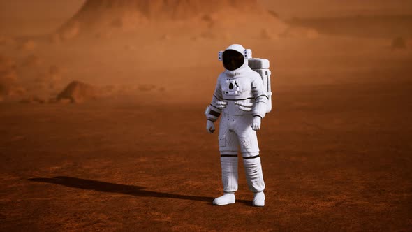 Astronaut on Mars Surface. Red Planet Covered in Gas and Rock