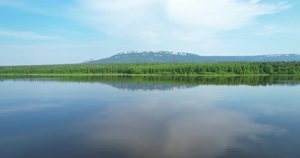 The Water Surface of the Lake with a Reflection of the Colorful Landscape