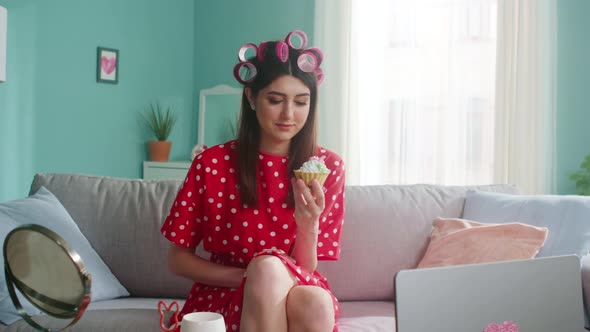 Woman Is Looking On Cake