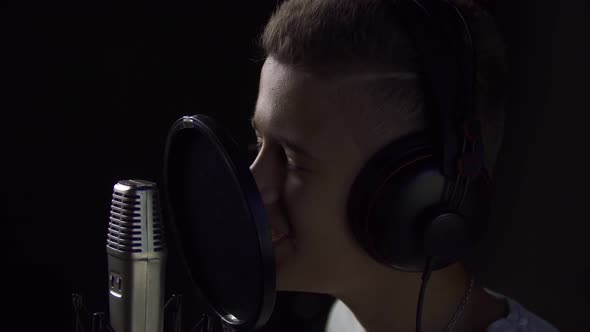 Boy Singing in Studio