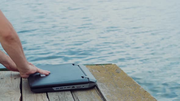 Mans Hands Using Laptop Computer.