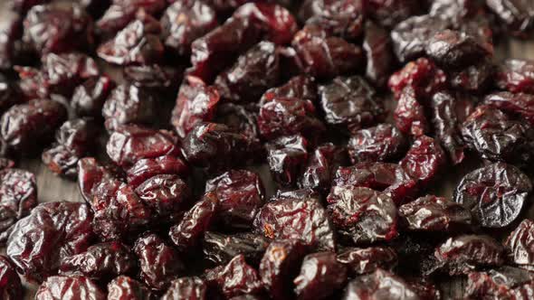 Dehydrated red cranberries on table shallow DOF 4K 2160p 30fps UltraHD tilting footage - Red dried b