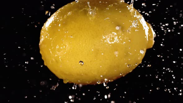 Flying of Lemon in Black Background in Slow Motion