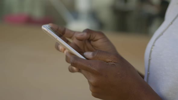Closeup Shot of Female Hands Typing on Smartphone