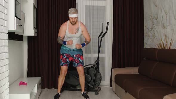 Funny Fat Sportsman Guy Couch Making Running Cardio Exercises for Online Weight Loss Vlog at Home