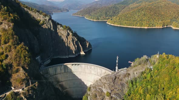 Aerial drone view of nature in Romania. Valley in Carpathian mountains with Vidraru dam and lake