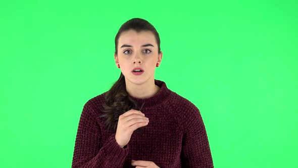 Girl Looks in Carefully at Camera and Is Shocked By What She Saw. Green Screen