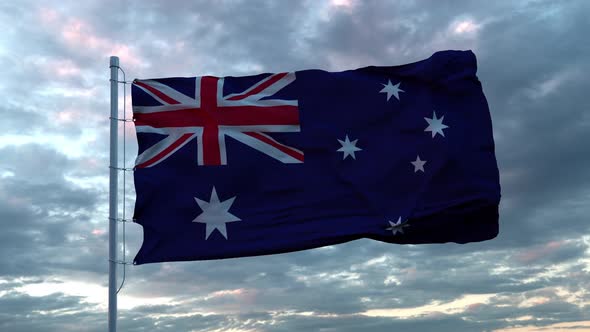 Realistic Flag of Australia Waving in the Wind Against Deep Dramatic Sky.  UHD 50 FPS