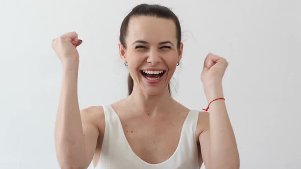 Excited Young Woman Celebrating Success Portrait