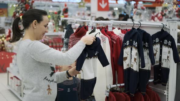 Woman with Little Daughter Choosing Xmas Presents