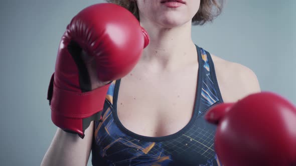 Beautiful Sporty Woman Posing Wearing Boxing Gloves