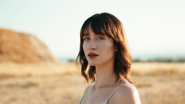 Pretty Charming Girl with Short Hair in the Countryside