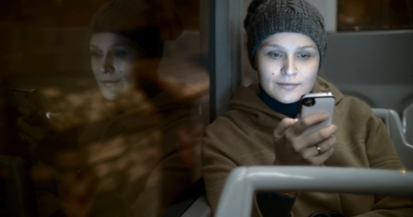 Woman In The Bus Using Smart Phone alt