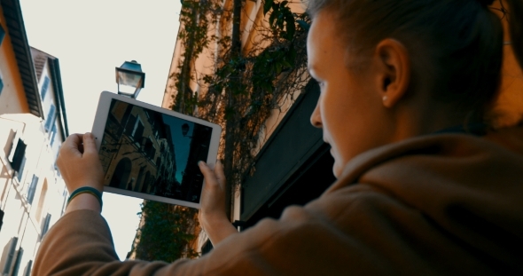 Tourist Taking Architecture Pictures Using Touch alt