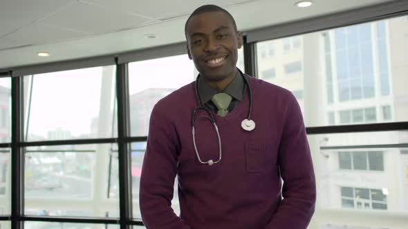 A Black Male Medical Professional Walks Up To The Camera (1 Of 5) alt