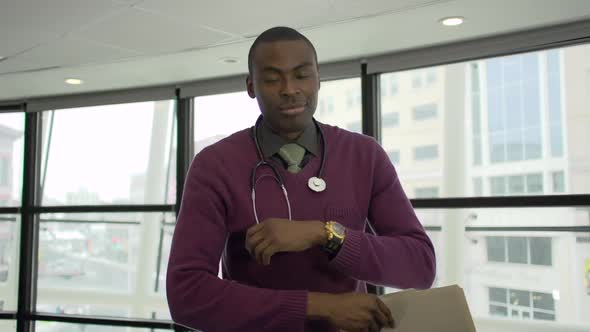 A Black Male Medical Professional Walks Up To The Camera (2 Of 5)