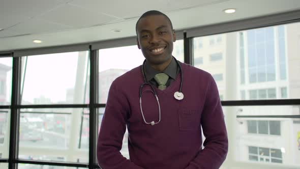 A Black Male Medical Professional Walks Up To The Camera (3 Of 5)