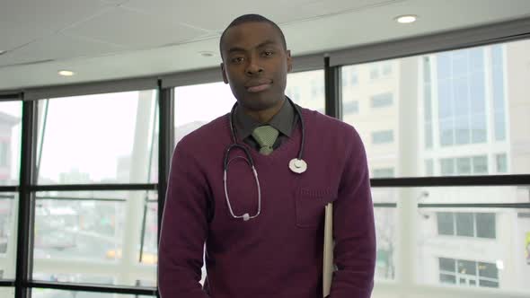 A Black Male Medical Professional Walks Up To The Camera (5 Of 5)