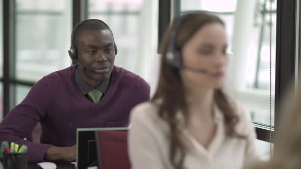 A Black Man Works In A Attractive Modern Call Center (1 Of 4)