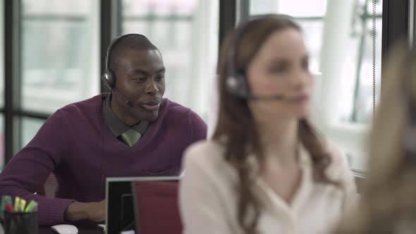 A Black Man Works In A Attractive Modern Call Center (3 Of 4)