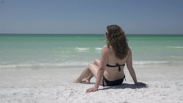 Woman Relaxing On A Morning Beach  (6 Of 9) alt
