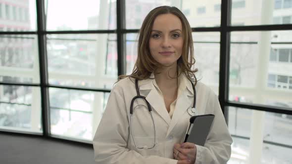 A Caucasian Female Medical Professional Walks Up To The Camera (1 Of 9)