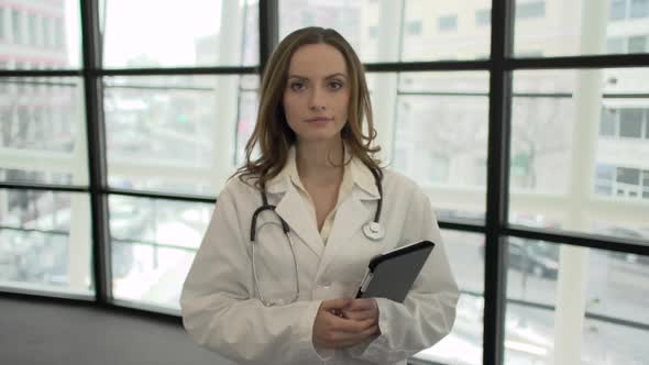 A Caucasian Female Medical Professional Walks Up To The Camera (4 Of 9)