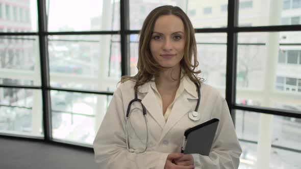 A Caucasian Female Medical Professional Walks Up To The Camera (5 Of 9)