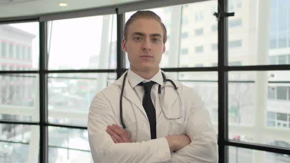 A Caucasian Male Medical Professional Walks Up To The Camera (2 Of 10)