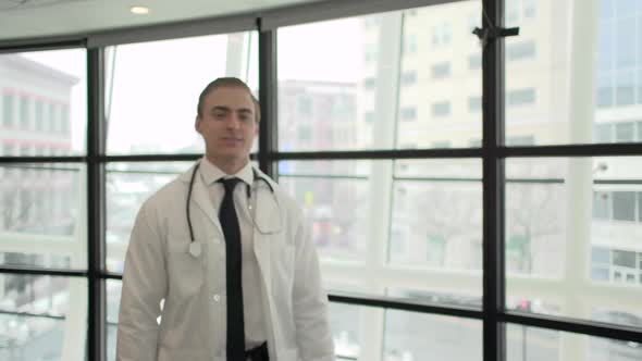 A Caucasian Male Medical Professional Walks Up To The Camera (4 Of 10)