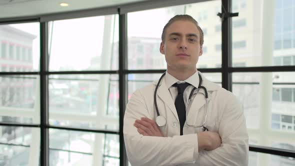 A Caucasian Male Medical Professional Walks Up To The Camera (5 Of 10)